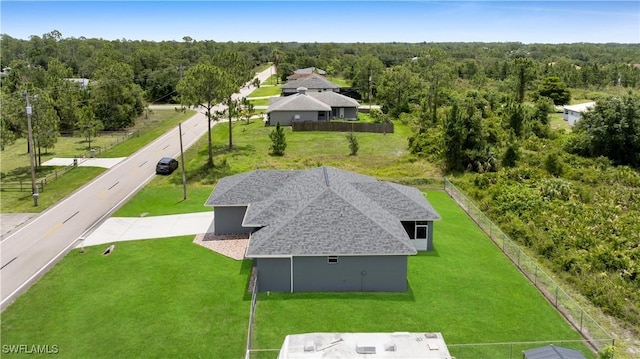 902 E 10th St, Lehigh Acres, FL 33972 - view from above of property with a heavily wooded area