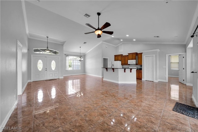 902 E 10th St, Lehigh Acres, FL 33972 - unfurnished living room with a ceiling fan, crown molding, a chandelier, and high vaulted ceiling