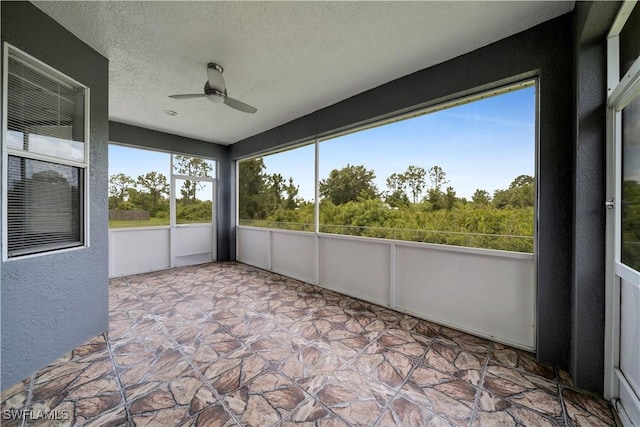 902 E 10th St, Lehigh Acres, FL 33972 - unfurnished sunroom featuring ceiling fan