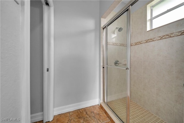 902 E 10th St, Lehigh Acres, FL 33972 - full bathroom with a stall shower and baseboards