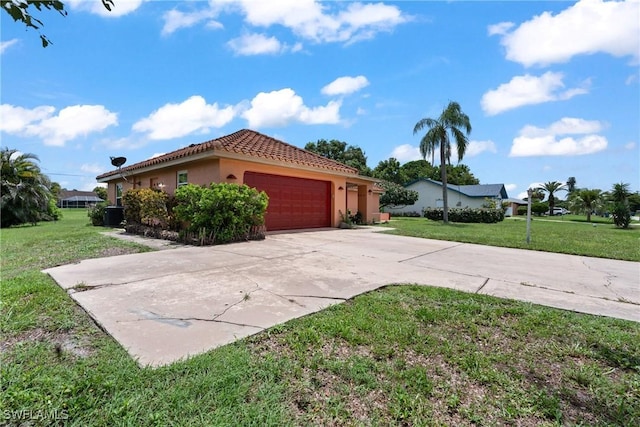 1422 Archer St, Lehigh Acres, FL 33936 - view of side of home with an attached garage, a yard, a tile roof, driveway, and stucco siding