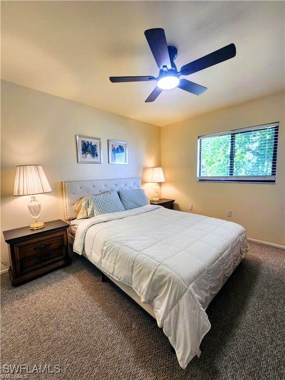 1221 Barrett Rd Unit 905, North Fort Myers, FL 33903 - carpeted bedroom featuring a ceiling fan and baseboards