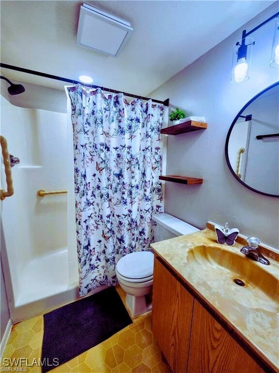 1221 Barrett Rd Unit 905, North Fort Myers, FL 33903 - full bath featuring vanity and a shower with curtain