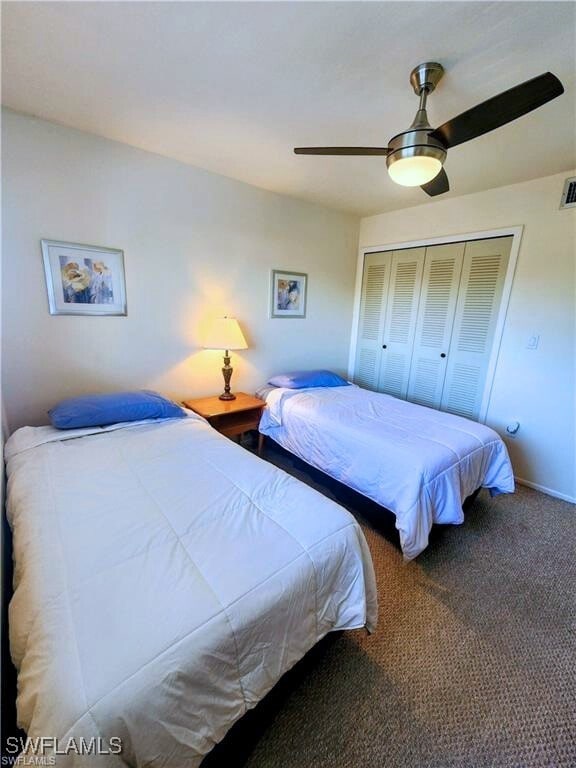 1221 Barrett Rd Unit 905, North Fort Myers, FL 33903 - bedroom featuring a closet, ceiling fan, and carpet