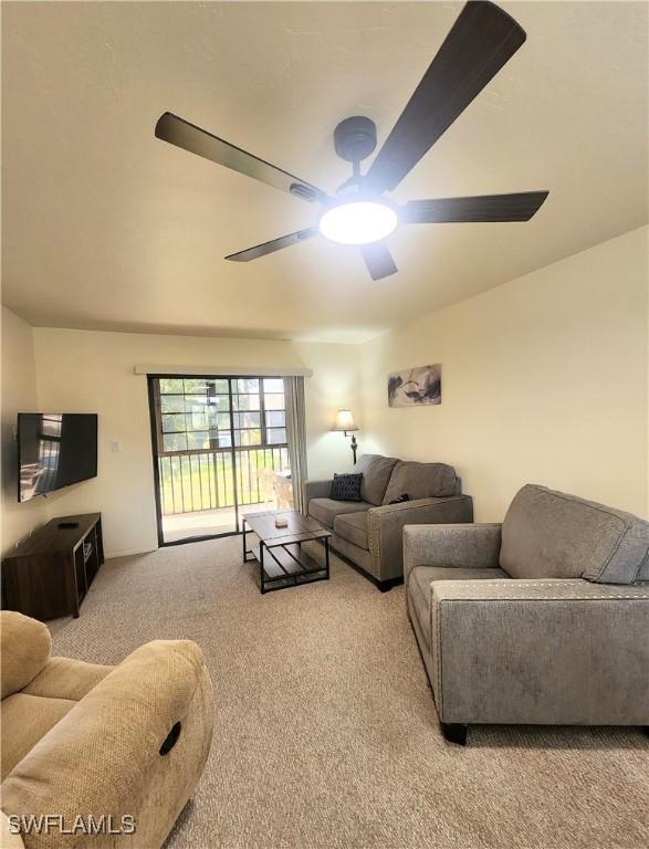 1221 Barrett Rd Unit 905, North Fort Myers, FL 33903 - carpeted living room with ceiling fan