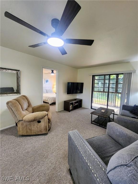 1221 Barrett Rd Unit 905, North Fort Myers, FL 33903 - living room featuring a ceiling fan and carpet floors