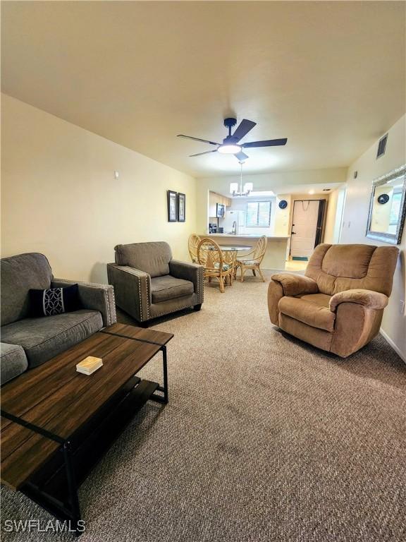 1221 Barrett Rd Unit 905, North Fort Myers, FL 33903 - living area featuring carpet floors and a ceiling fan