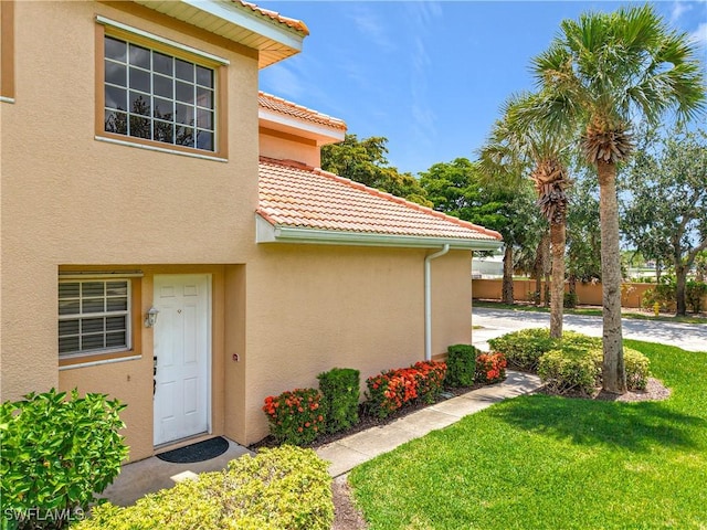 14031 W Hyde Park Dr Unit 201, Fort Myers, FL 33912 - doorway to property featuring stucco siding and a tile roof