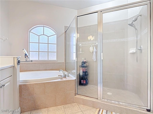 14031 W Hyde Park Dr Unit 201, Fort Myers, FL 33912 - full bath featuring a stall shower, a garden tub, tile patterned flooring, and vanity