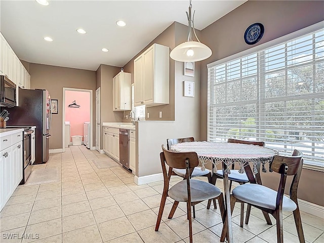 14031 W Hyde Park Dr Unit 201, Fort Myers, FL 33912 - dining space featuring light tile patterned flooring, washer and clothes dryer, and recessed lighting