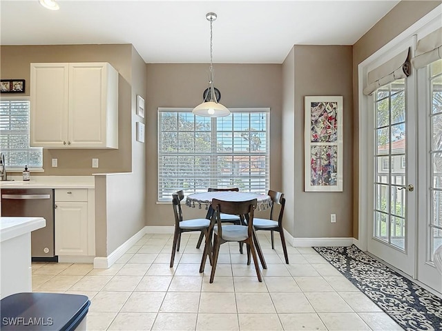 14031 W Hyde Park Dr Unit 201, Fort Myers, FL 33912 - dining area featuring plenty of natural light and light tile patterned flooring