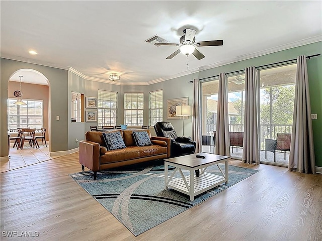 14031 W Hyde Park Dr Unit 201, Fort Myers, FL 33912 - living room with arched walkways, ceiling fan, light wood-style floors, ornamental molding, and recessed lighting