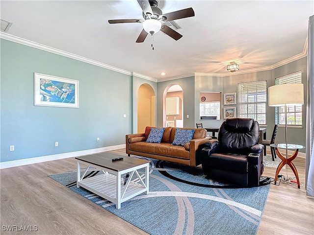 14031 W Hyde Park Dr Unit 201, Fort Myers, FL 33912 - living area with arched walkways, light wood-style flooring, crown molding, a ceiling fan, and recessed lighting