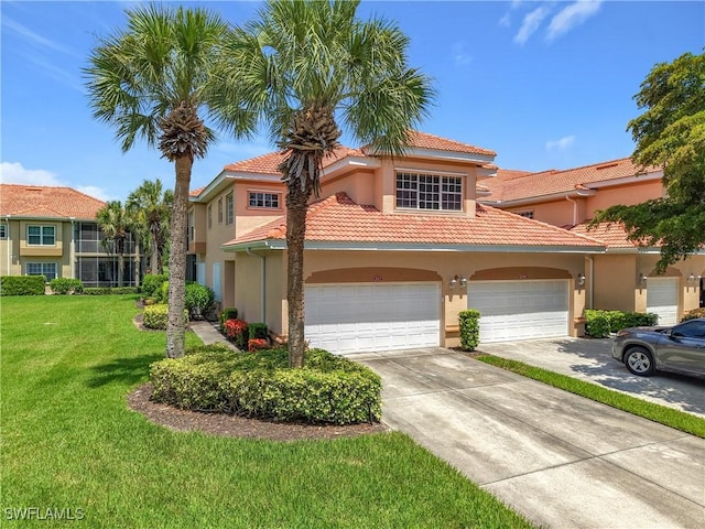 14031 W Hyde Park Dr Unit 201, Fort Myers, FL 33912 - view of front of home with concrete driveway, a tiled roof, stucco siding, and a front yard