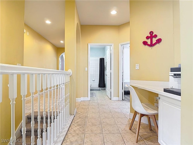 14031 W Hyde Park Dr Unit 201, Fort Myers, FL 33912 - hall with arched walkways, light tile patterned flooring, and recessed lighting