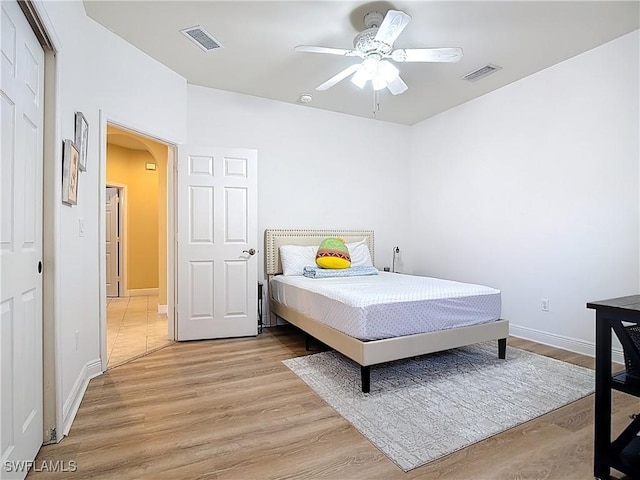 14031 W Hyde Park Dr Unit 201, Fort Myers, FL 33912 - bedroom featuring arched walkways, light wood-type flooring, and ceiling fan
