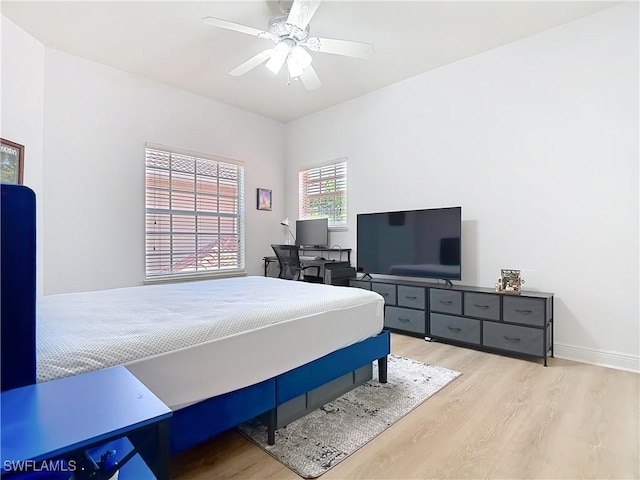 14031 W Hyde Park Dr Unit 201, Fort Myers, FL 33912 - bedroom with wood finished floors and a ceiling fan