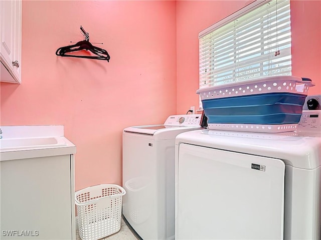 14031 W Hyde Park Dr Unit 201, Fort Myers, FL 33912 - laundry room featuring cabinet space and separate washer and dryer