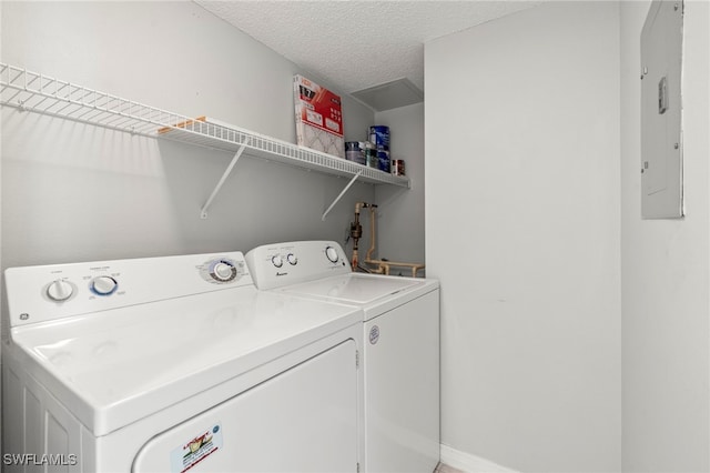 8851 Colonnades Ct W Unit 128, Bonita Springs, FL 34135 - washroom featuring independent washer and dryer, a textured ceiling, and electric panel