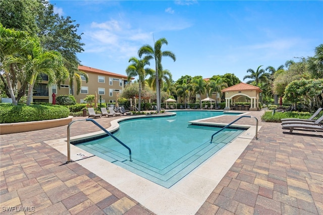 8851 Colonnades Ct W Unit 128, Bonita Springs, FL 34135 - community pool featuring a patio and a gazebo