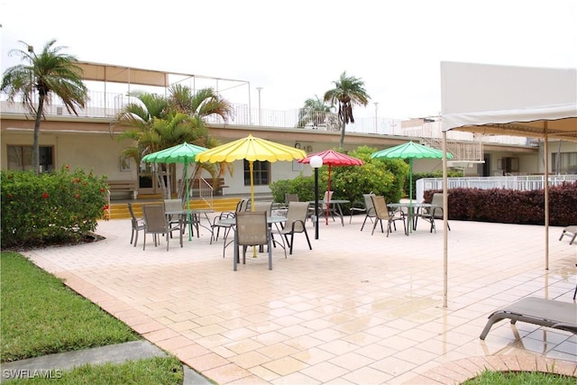1395 NE 167th St # 107, North Miami Beach, FL 33162 - view of patio featuring outdoor dining space