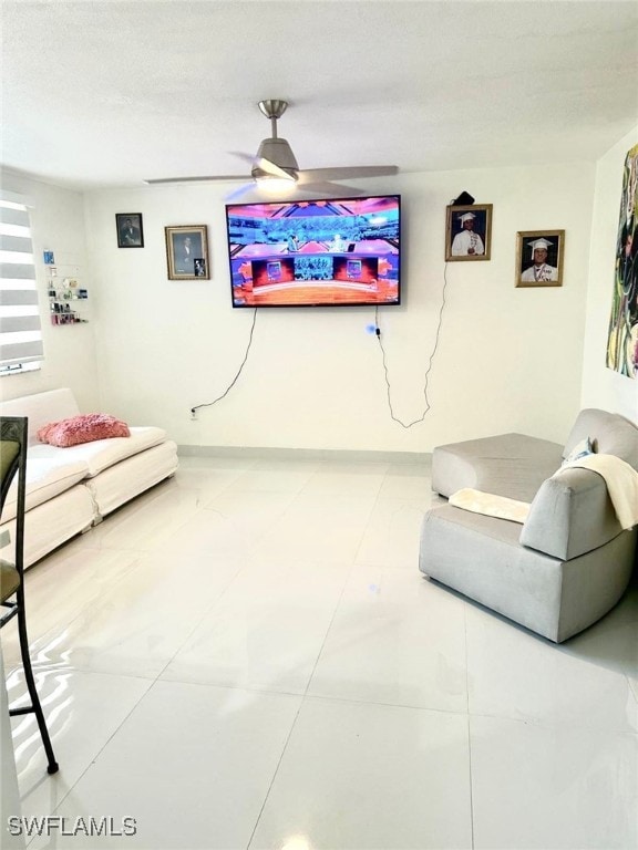 1395 NE 167th St # 107, North Miami Beach, FL 33162 - living area with ceiling fan and tile patterned flooring