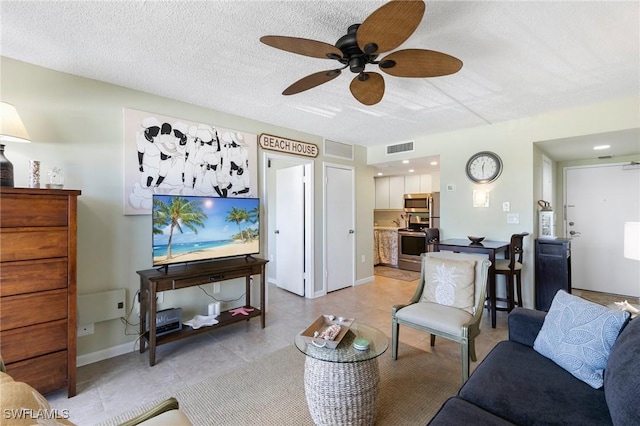 180 Seaview Ct Unit 314, Marco Island, FL 34145 - living room featuring a ceiling fan and light tile patterned flooring