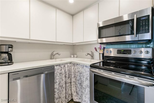 180 Seaview Ct Unit 314, Marco Island, FL 34145 - kitchen with stainless steel appliances, white cabinetry, light countertops, and modern cabinets