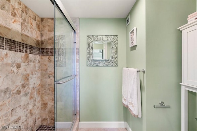 180 Seaview Ct Unit 314, Marco Island, FL 34145 - bathroom featuring a stall shower and baseboards