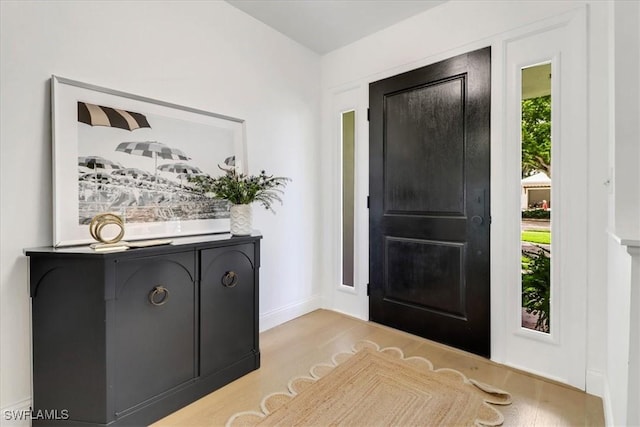 701 Harbour Dr, Naples, FL 34103 - entrance foyer featuring light wood-style floors and baseboards