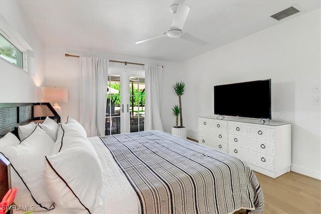 701 Harbour Dr, Naples, FL 34103 - bedroom featuring access to exterior, light wood-style floors, and ceiling fan