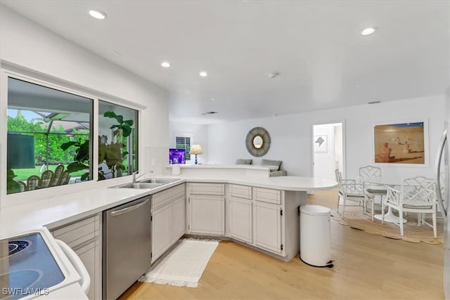 701 Harbour Dr, Naples, FL 34103 - kitchen with dishwasher, light countertops, light wood finished floors, recessed lighting, and a peninsula