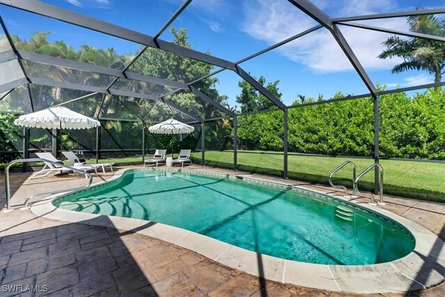 701 Harbour Dr, Naples, FL 34103 - swimming pool with a patio area, glass enclosure, and a yard