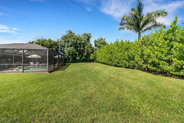 701 Harbour Dr, Naples, FL 34103 - view of green lawn featuring an outdoor pool and glass enclosure