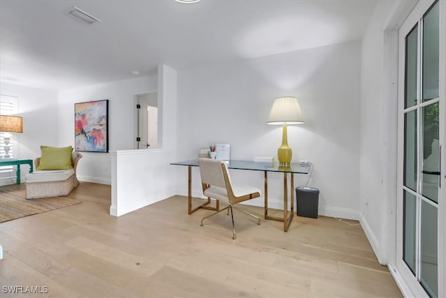 701 Harbour Dr, Naples, FL 34103 - office area featuring wood finished floors and baseboards