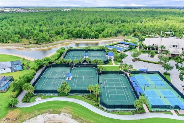 6787 Winding Cypress Dr, Naples, FL 34114 - bird's eye view of a forest and a nearby body of water