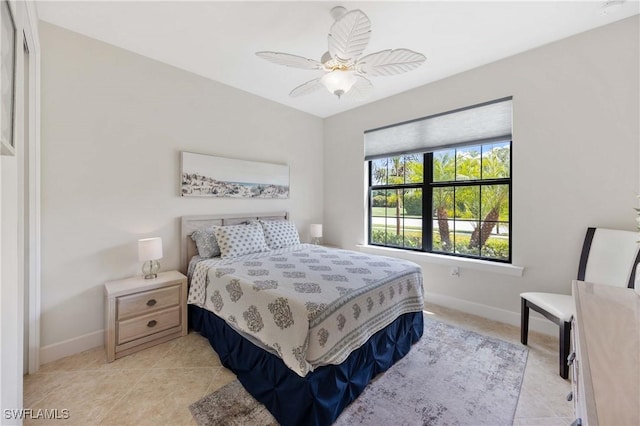 6787 Winding Cypress Dr, Naples, FL 34114 - bedroom with a ceiling fan and light tile patterned floors