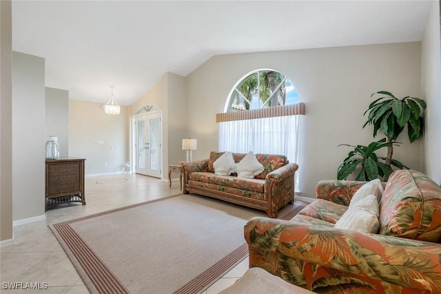 941 Ironwood Ct, Marco Island, FL 34145 - living room with vaulted ceiling and light tile patterned floors