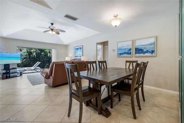 941 Ironwood Ct, Marco Island, FL 34145 - dining room with a raised ceiling, light tile patterned flooring, and a ceiling fan