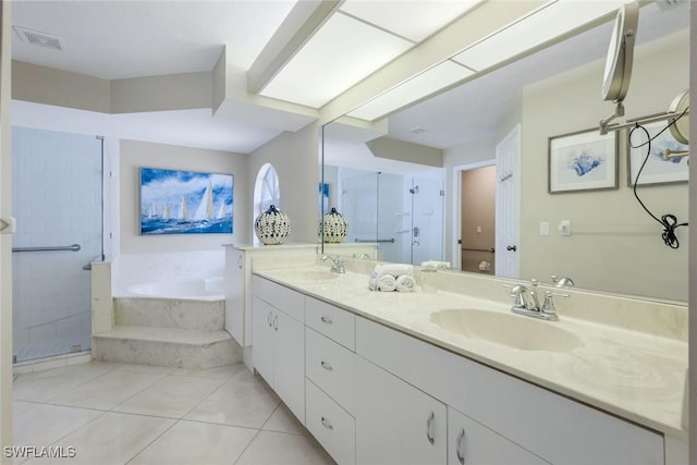 941 Ironwood Ct, Marco Island, FL 34145 - full bath with a garden tub, double vanity, a stall shower, and tile patterned flooring