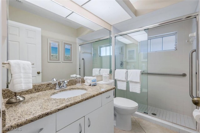 941 Ironwood Ct, Marco Island, FL 34145 - bathroom with vanity, a stall shower, and tile patterned floors