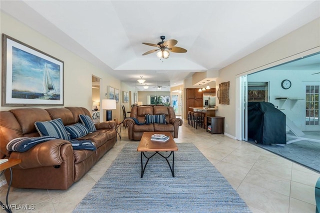 941 Ironwood Ct, Marco Island, FL 34145 - living area with ceiling fan, light tile patterned floors, vaulted ceiling, and healthy amount of natural light