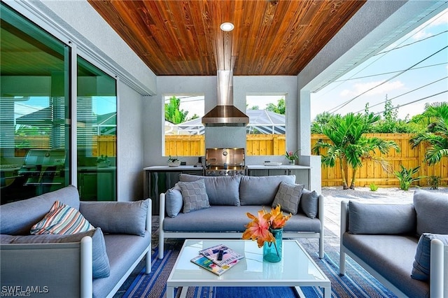 756 108th Ave N, Naples, FL 34108 - fenced backyard featuring outdoor lounge area and an outdoor kitchen