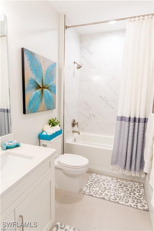 756 108th Ave N, Naples, FL 34108 - bathroom featuring vanity and shower / bathtub combination with curtain