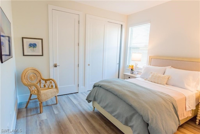 756 108th Ave N, Naples, FL 34108 - bedroom featuring wood finished floors and a closet