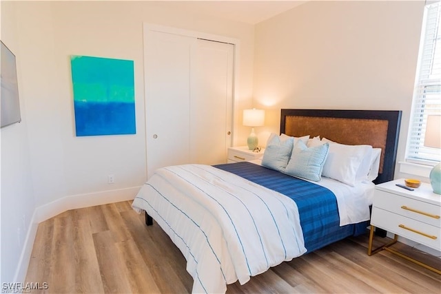 756 108th Ave N, Naples, FL 34108 - bedroom with wood finished floors and a closet