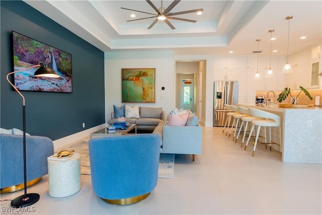 756 108th Ave N, Naples, FL 34108 - living room featuring a tray ceiling, a ceiling fan, and recessed lighting