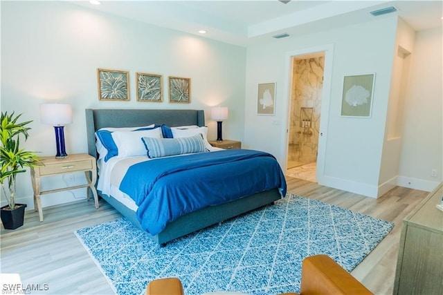 756 108th Ave N, Naples, FL 34108 - bedroom with wood finished floors, recessed lighting, and ensuite bath