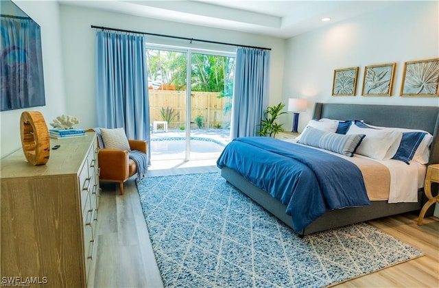 756 108th Ave N, Naples, FL 34108 - bedroom with access to exterior, light wood-style floors, and recessed lighting