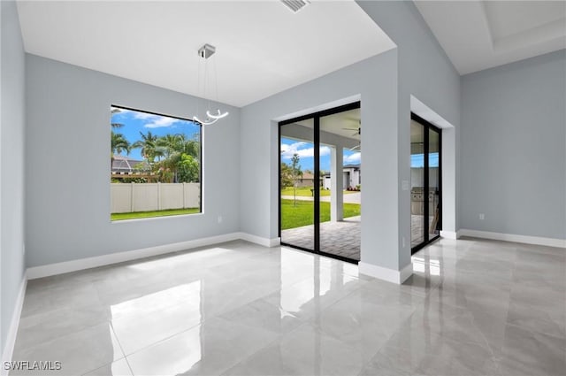2218 SW 25th St, Cape Coral, FL 33914 - unfurnished room featuring a chandelier and marble finish floors